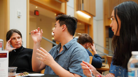 Ethan, on the student survey advisory group, shares his thoughts during a meeting.