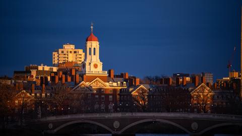 A sunset view of Dunster House on the bridge with Weeks Bridge in the foreground.