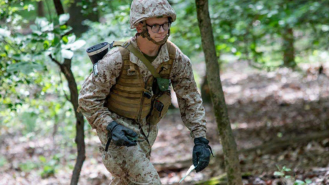 Jack Swanson taking a land navigation examination in the woods of Quantico, Virginia.