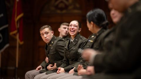 Student laughing on stage at the Joint RPTC Commissioning ceremony for the Class of 2025.