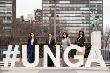 4 students stand in NYC, with #UNGA.