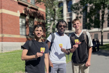 3 students stand with Ice Cream.