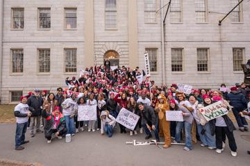 A large group of Winthrop House students on the steps of University Hall on Housing Day.