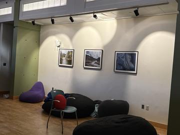 The Mather House tranquility room with beanbags and low light, and framed landscape art on the wall.