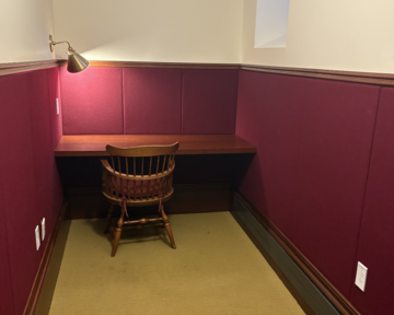 A photo of the desk and chair in the Serenity Room in Randolph Building of Adams House.