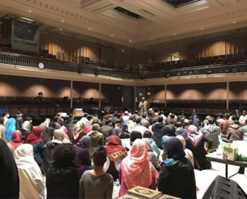 A photo of Friday prayers at Lowell House lecture hall.
