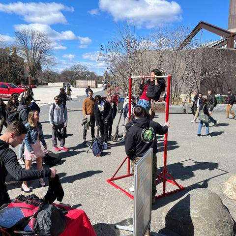 Students gather in the Science Center Plaza to attempt the Marine Corps PLC Pull-Up Challenge.