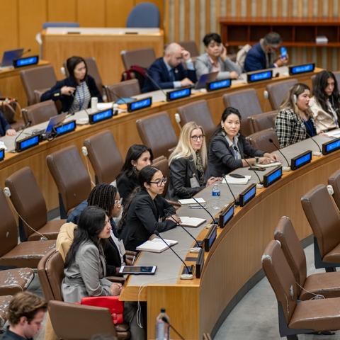 Students engaging with attendees at the United Nations Commission on the Status of Women.