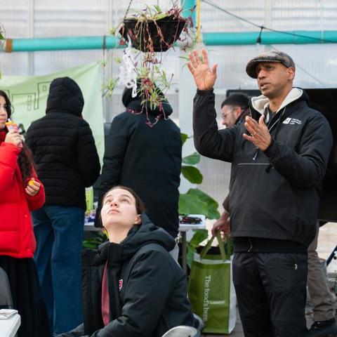 Students in a green house during a sustainability program.