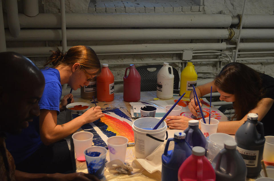 Students painting artwork
