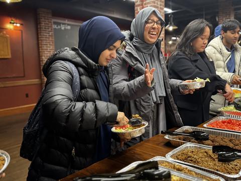 Students getting served their meal during the DSO-sponsored iftar during Ramadan 2025.