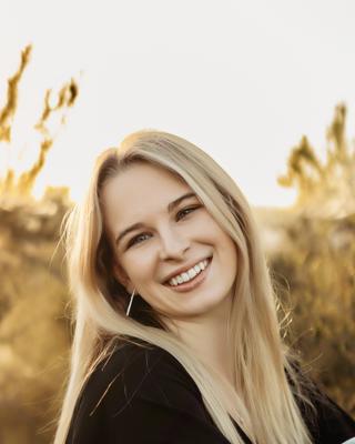 A headshot of Madeline Armstrong.