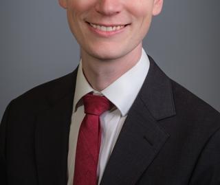 A headshot of John Nowak.