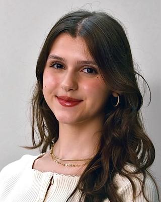 A headshot of Dea Kamberi.