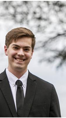 A headshot of Caleb Masshardt.