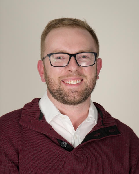 A headshot of Brett Monson.