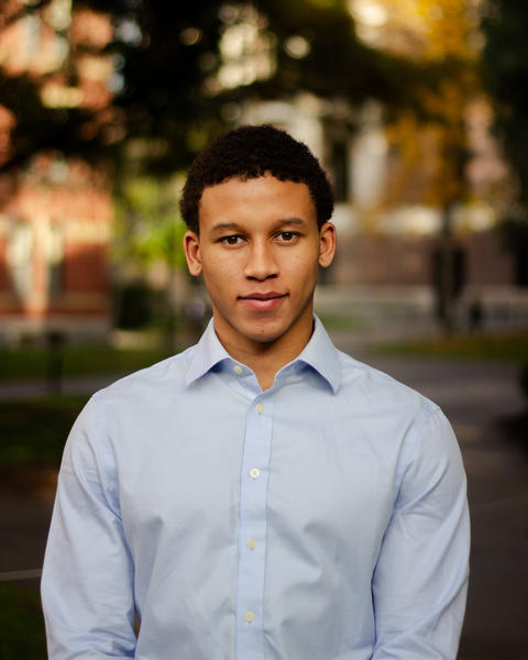 A headshot of Justin Hill.