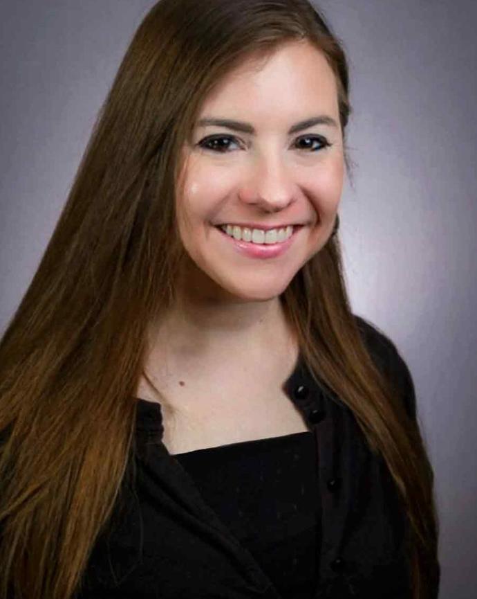 A headshot of Emilie Raymer.